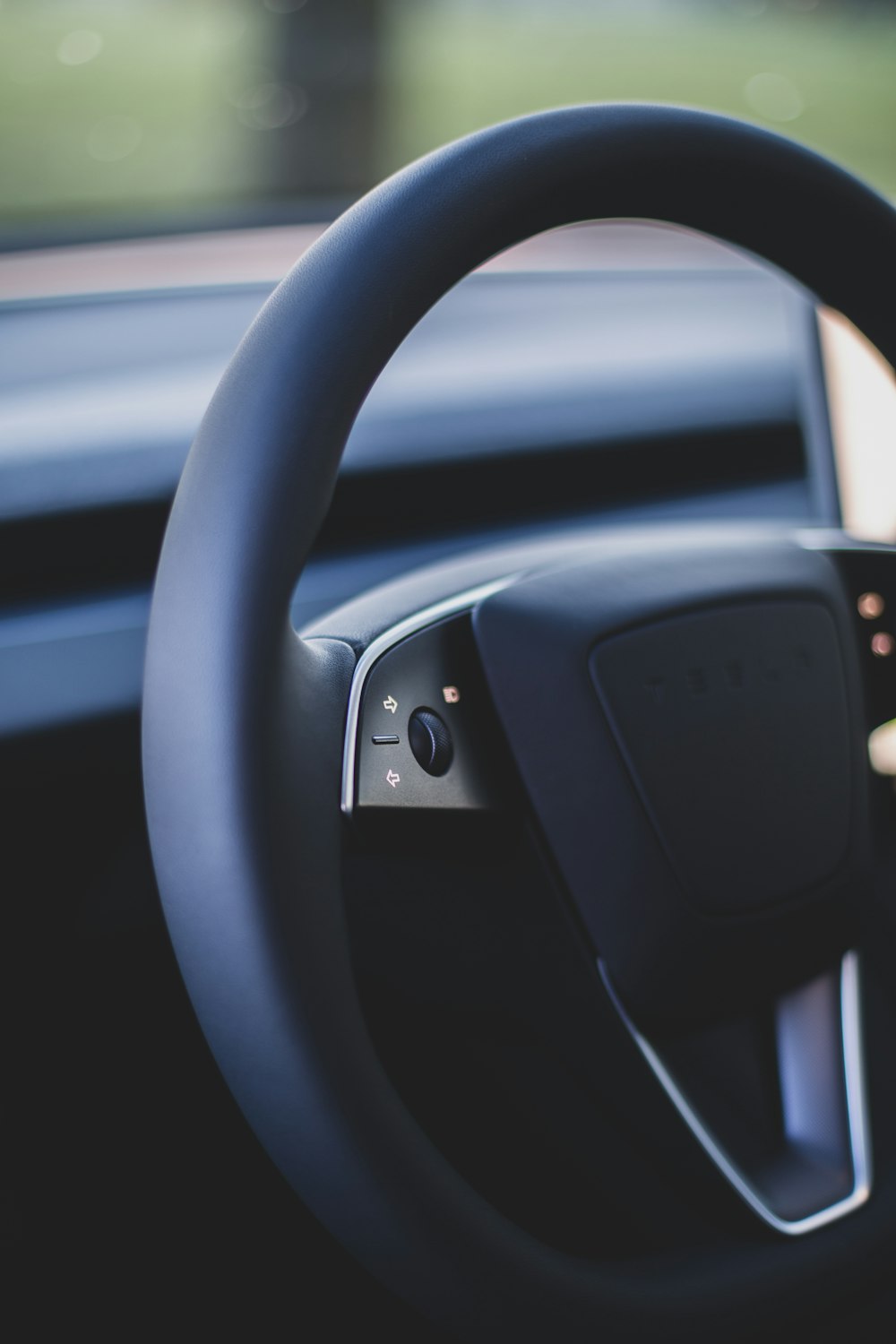 a close up of a steering wheel of a car