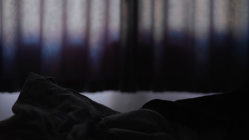 a blurry photo of a person laying in bed