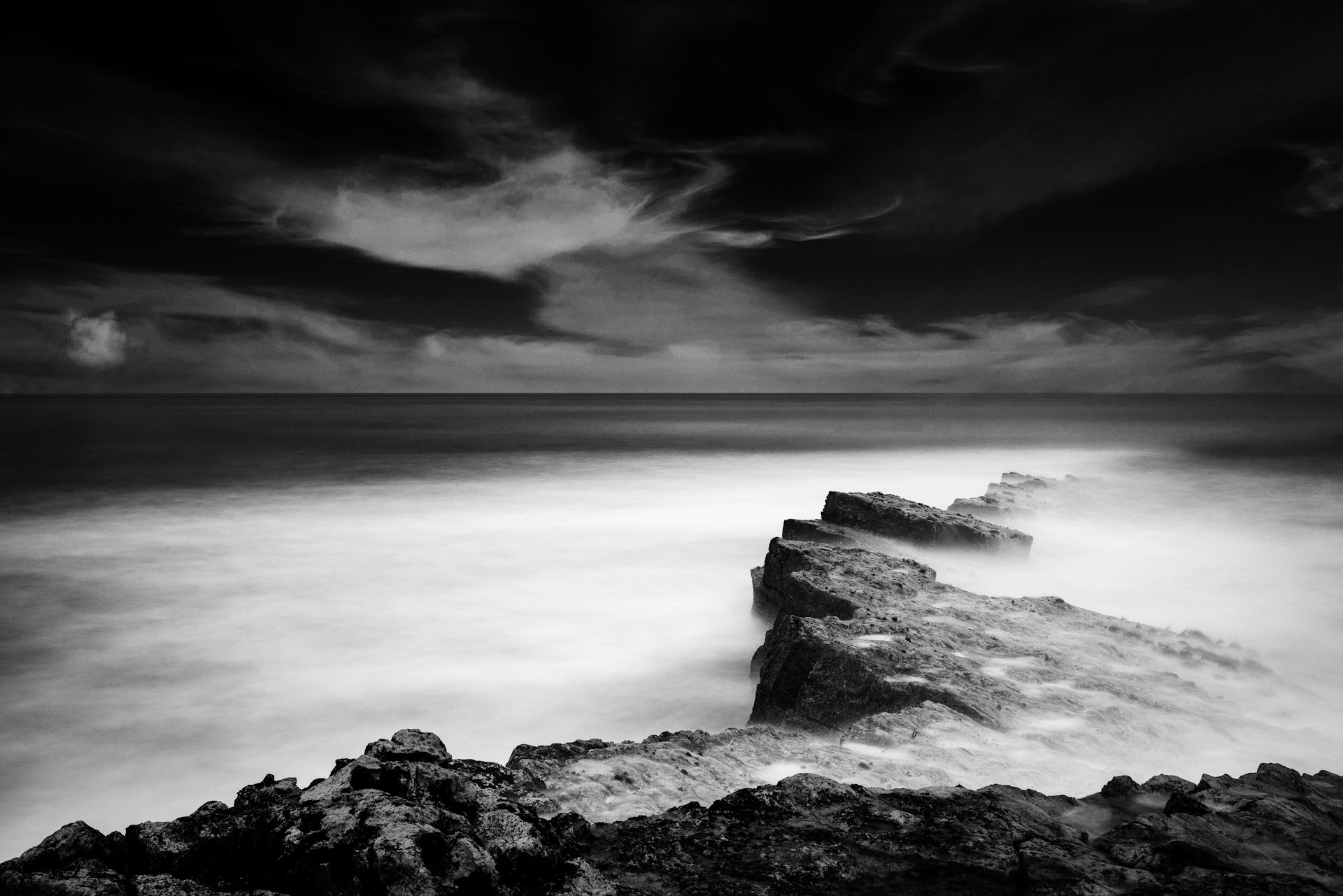 a black and white photo of the ocean