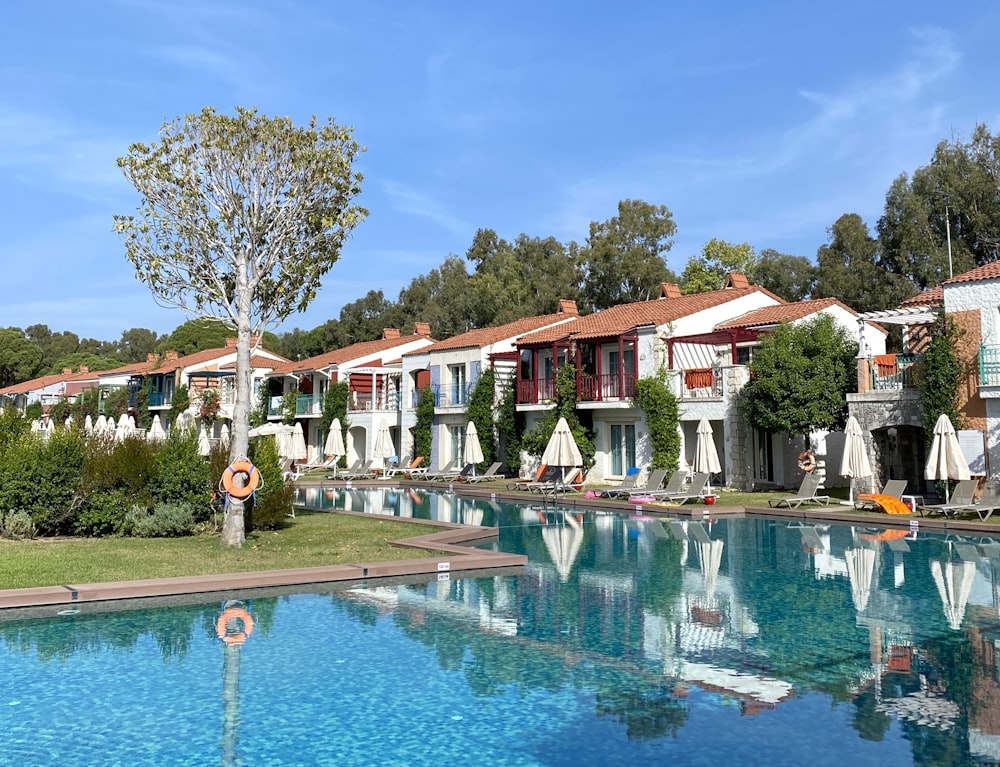 a row of houses next to a swimming pool