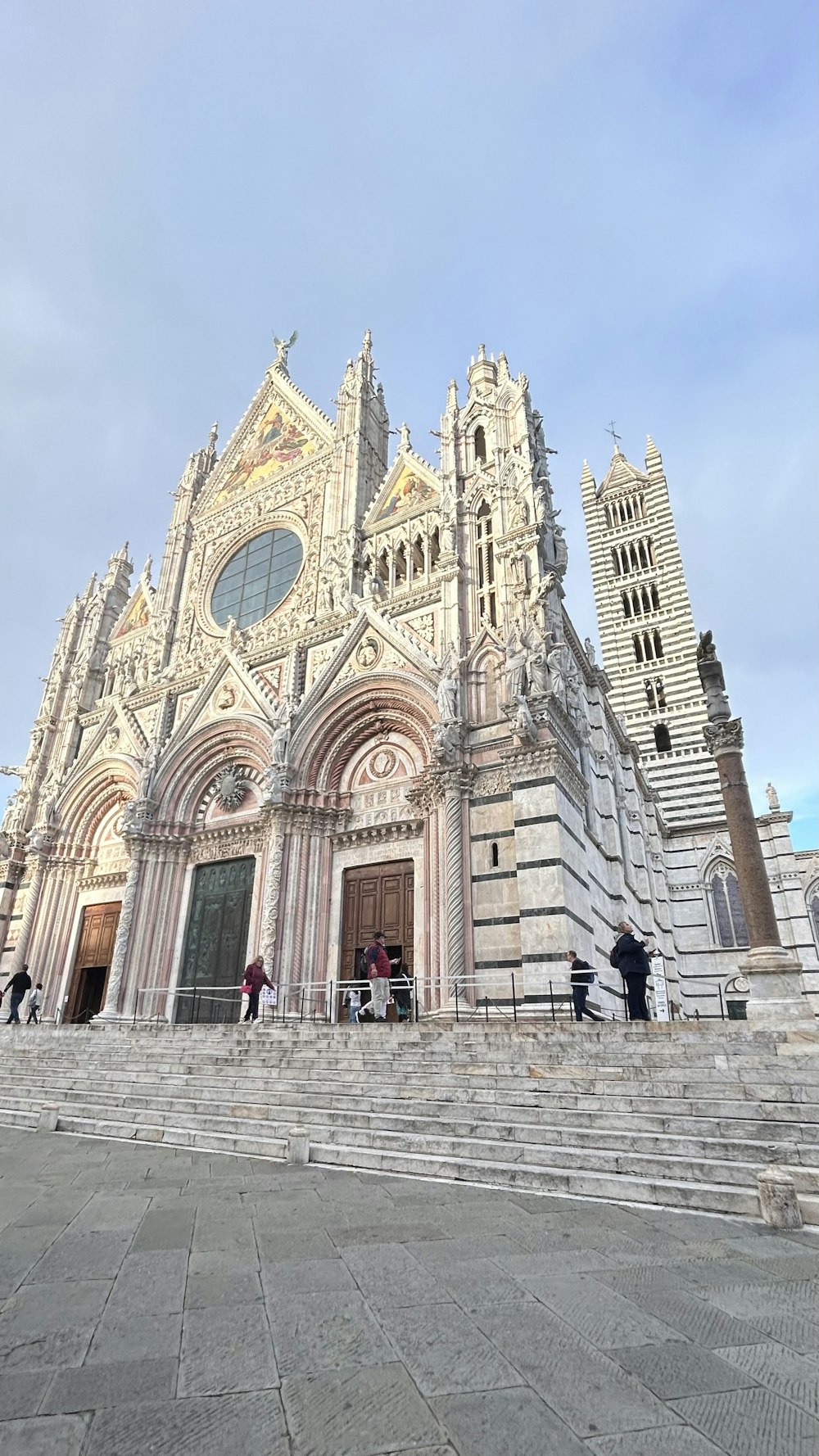 a large cathedral with stairs leading up to it