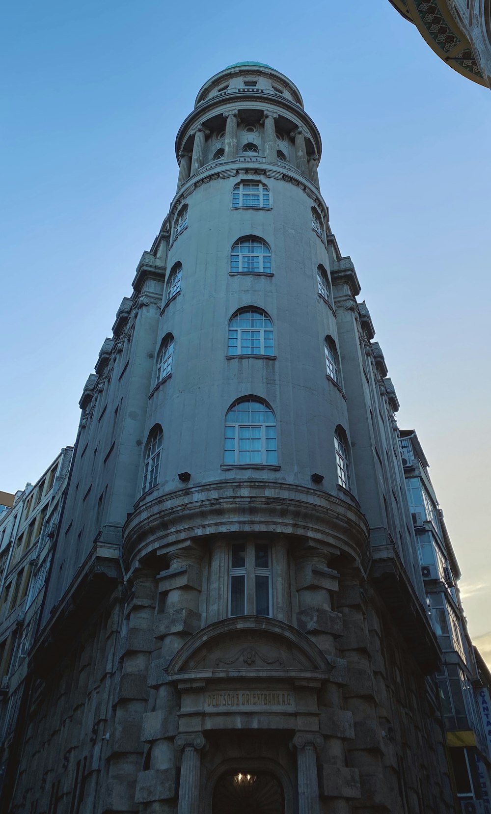 a tall building with a clock on the top of it