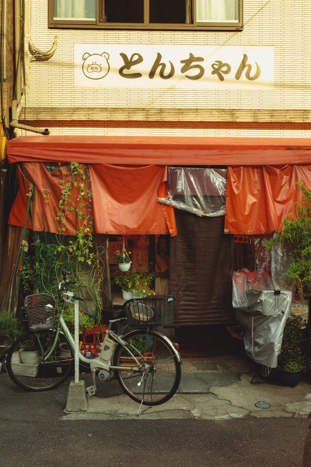 a bicycle parked in front of a store