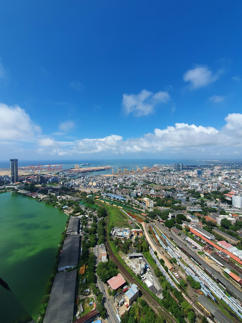 an aerial view of a city and a body of water