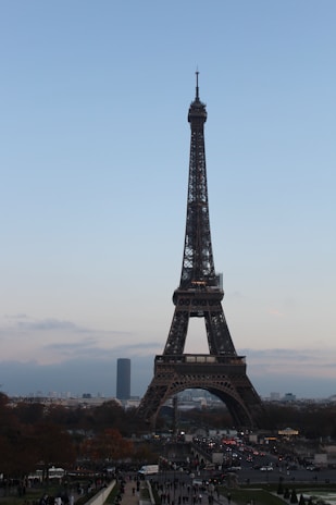 A vibrant photo of the Eiffel Tower in Paris under a clear blue sky.