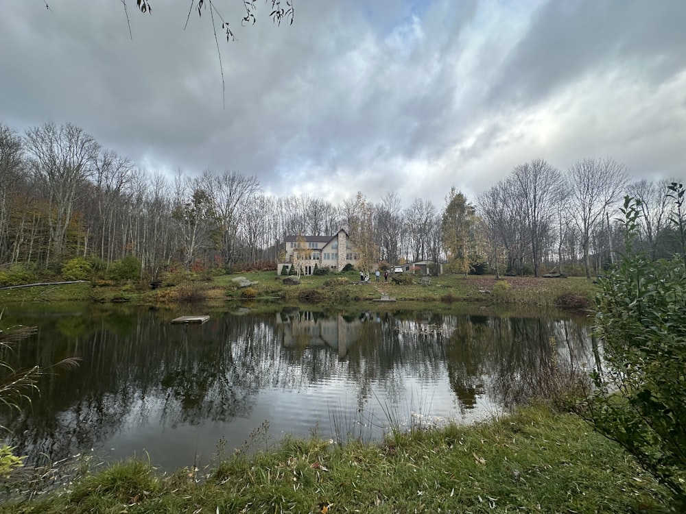 a large house sitting on top of a lush green field