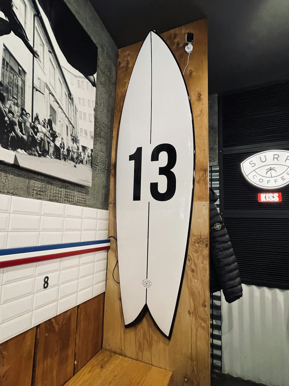 a surfboard mounted to a wall in a room