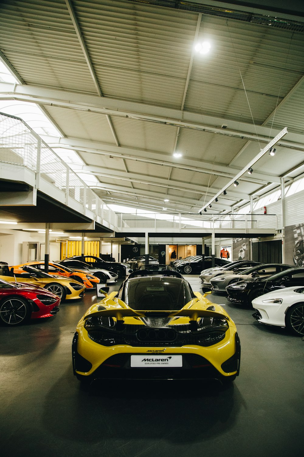 a bunch of cars are parked in a garage