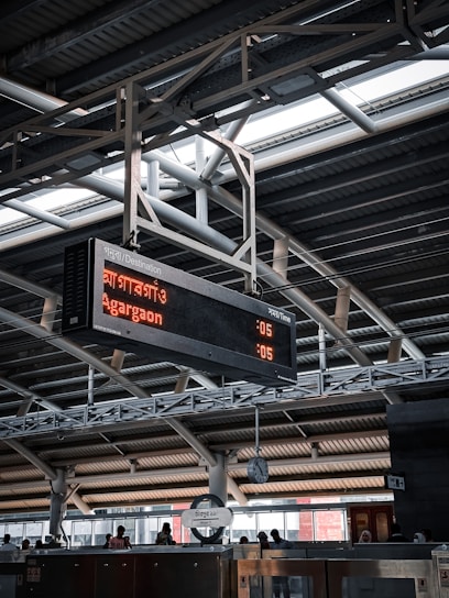 A dynamic control room with screens showing metro, tram, light rail, and train schedules in real-time.