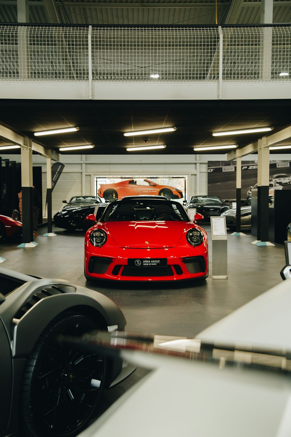 a red sports car parked in a garage