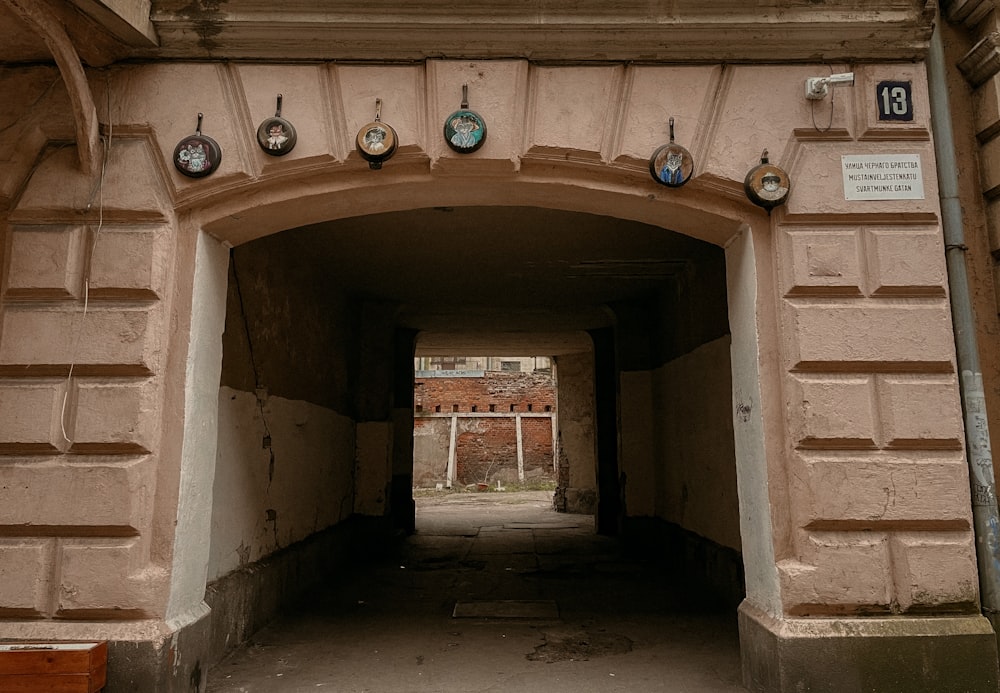 a tunnel with clocks on the side of it