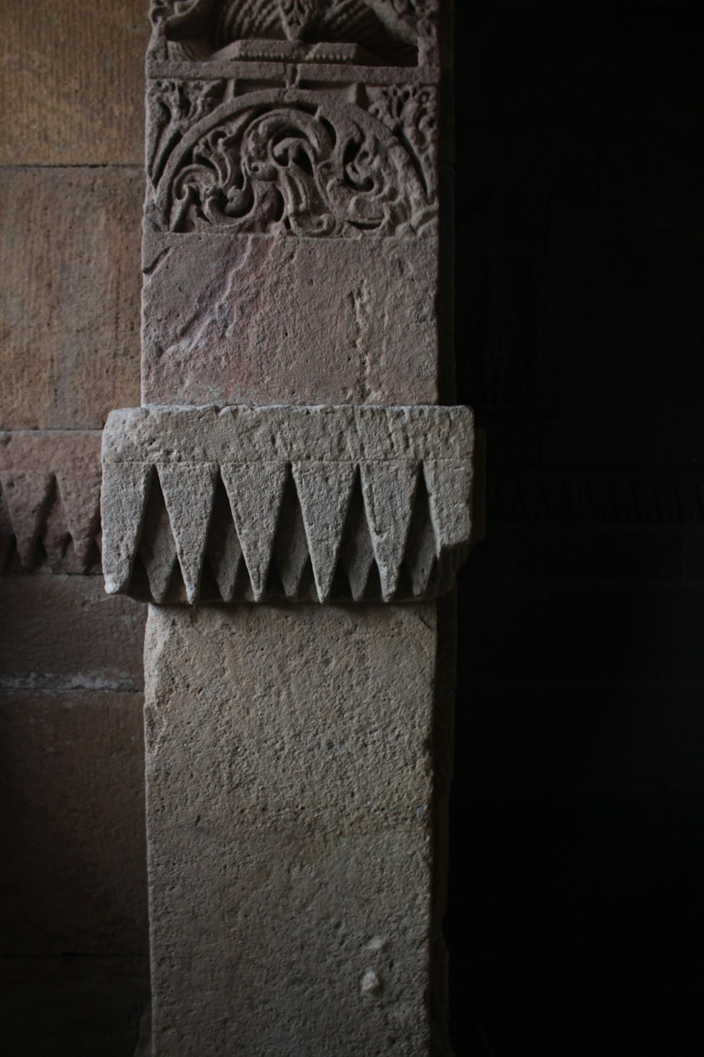 a close up of a stone pillar with carvings on it