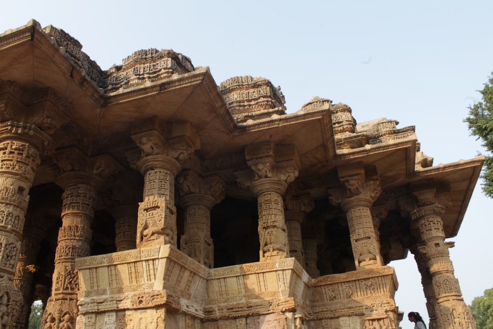 a large stone structure with many pillars