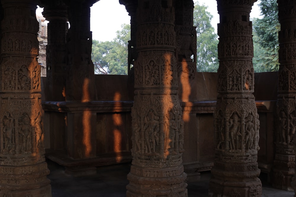a group of pillars with carvings on them