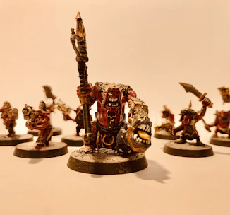 Close-up of a detailed 3D printed miniature figurine with vibrant colors.