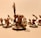 A group of intricately detailed fantasy miniatures with exaggerated features and expressive faces, arranged in a dynamic pose. The figures are painted with attention to detail, featuring sharp weapons and fierce expressions.