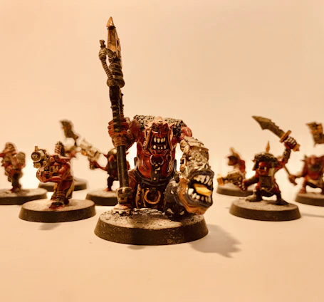 A close-up of a hand-painted fantasy figurine with intricate details and vibrant colors.