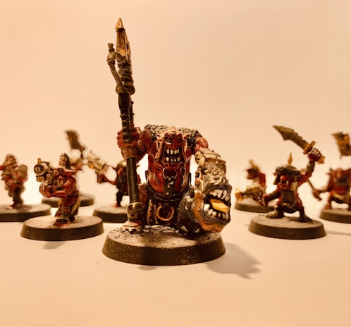 Close-up of beautifully painted RPG miniatures displayed on a gaming table.