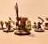 A group of intricately detailed fantasy miniatures with exaggerated features and expressive faces, arranged in a dynamic pose. The figures are painted with attention to detail, featuring sharp weapons and fierce expressions.