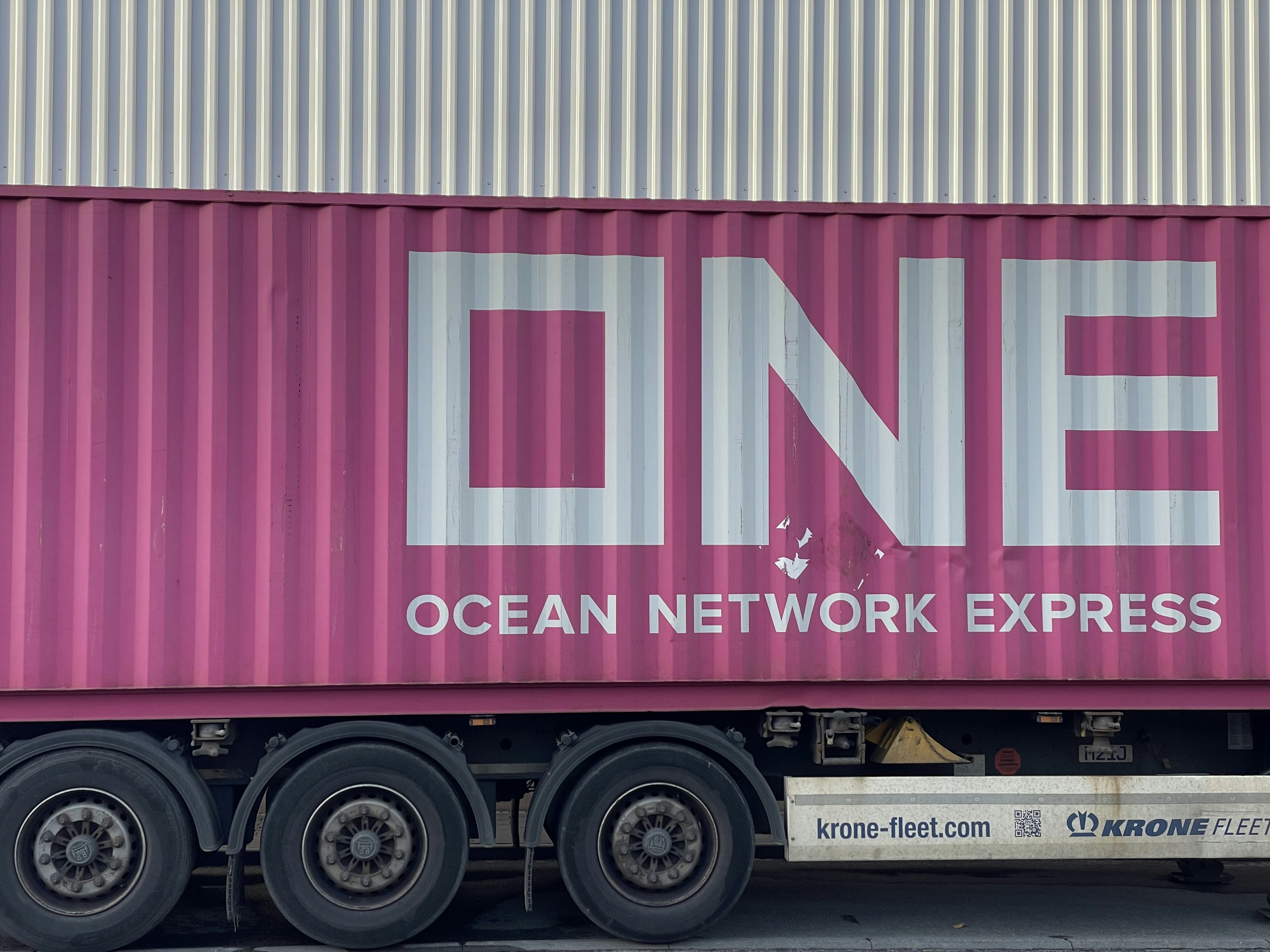a pink truck with the word ocean network express painted on it
