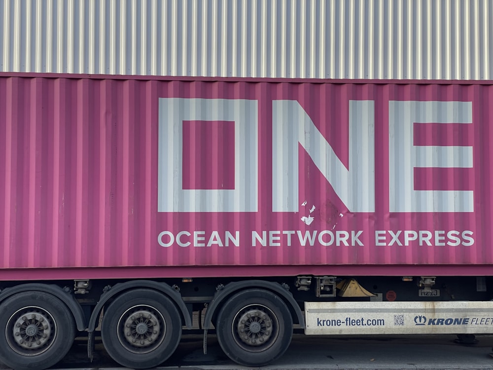 a pink truck with the word ocean network express painted on it