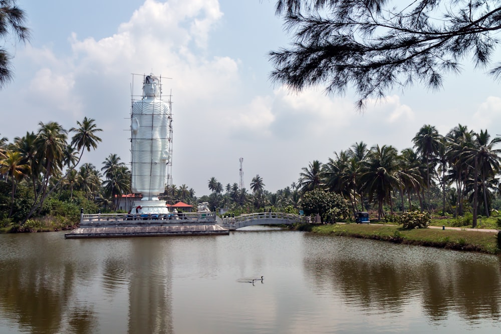 a body of water surrounded by palm trees