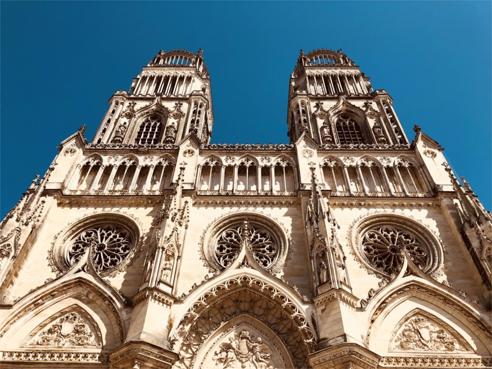 a very tall cathedral with a sky in the background