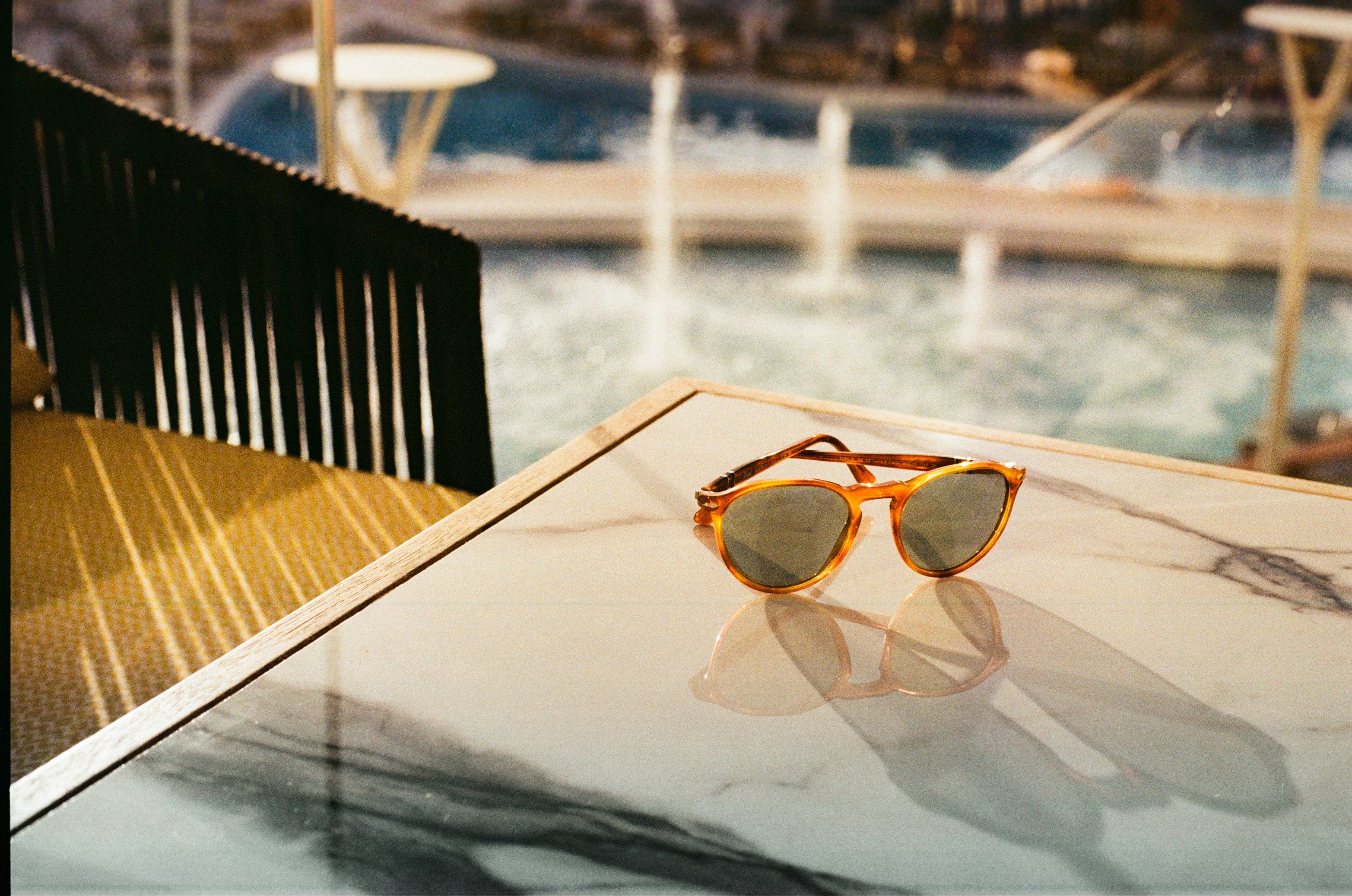 a pair of sunglasses sitting on top of a table