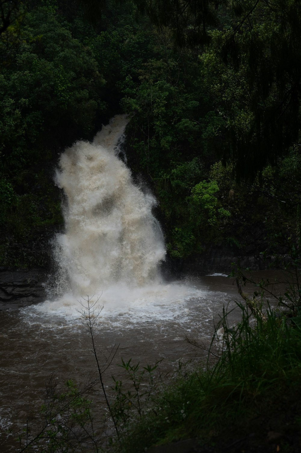 a large waterfall with water coming out of it