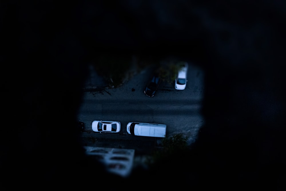 a view of a street from a vehicle's rear view mirror