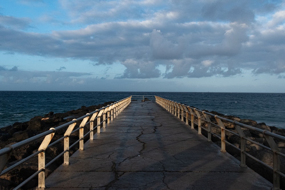 a long wooden bridge over a body of water