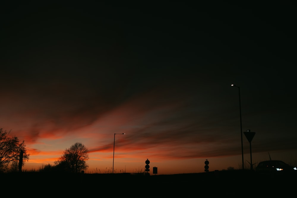 a dark sky with clouds and street lights