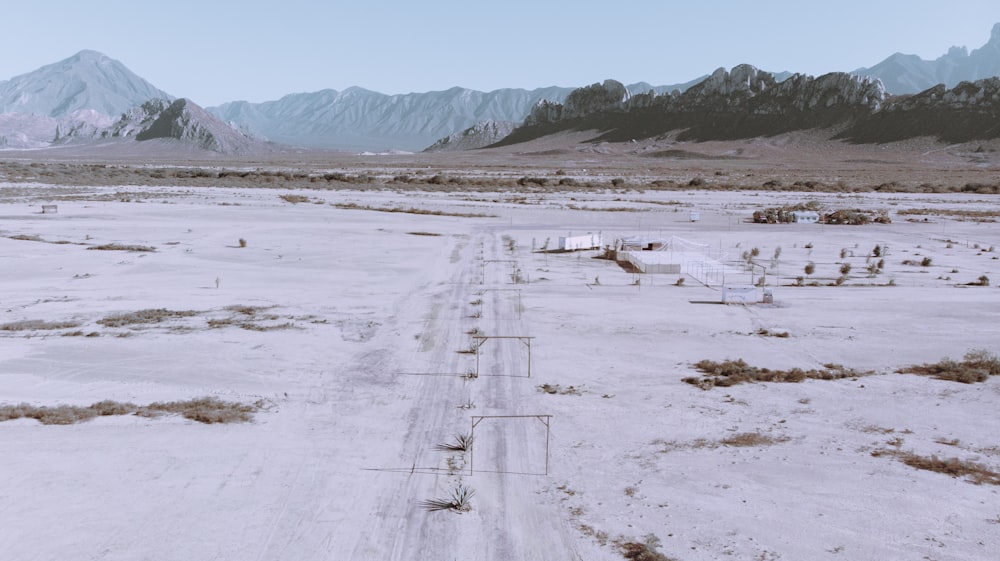 a dirt road in the middle of a desert