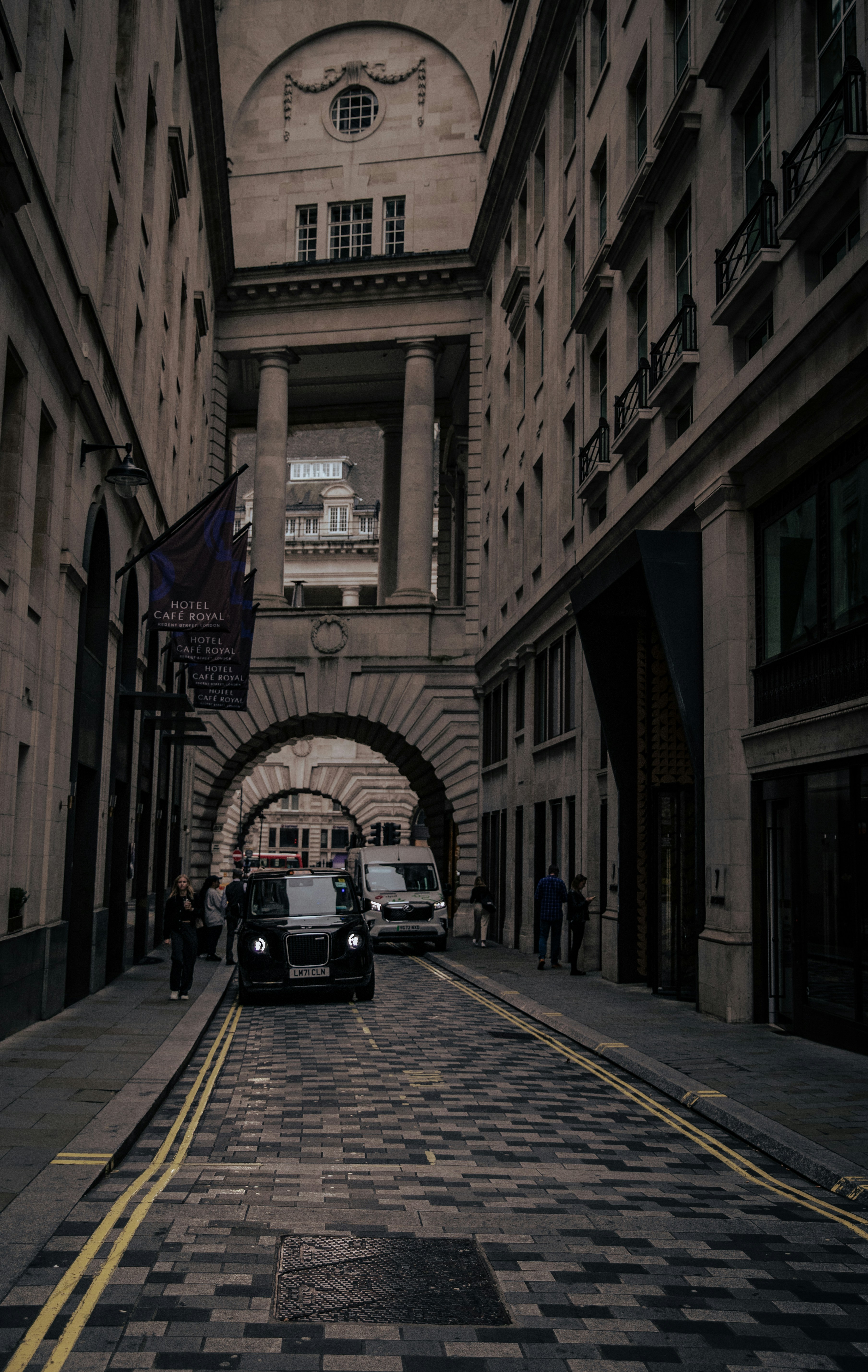 a couple of cars that are sitting in the street
