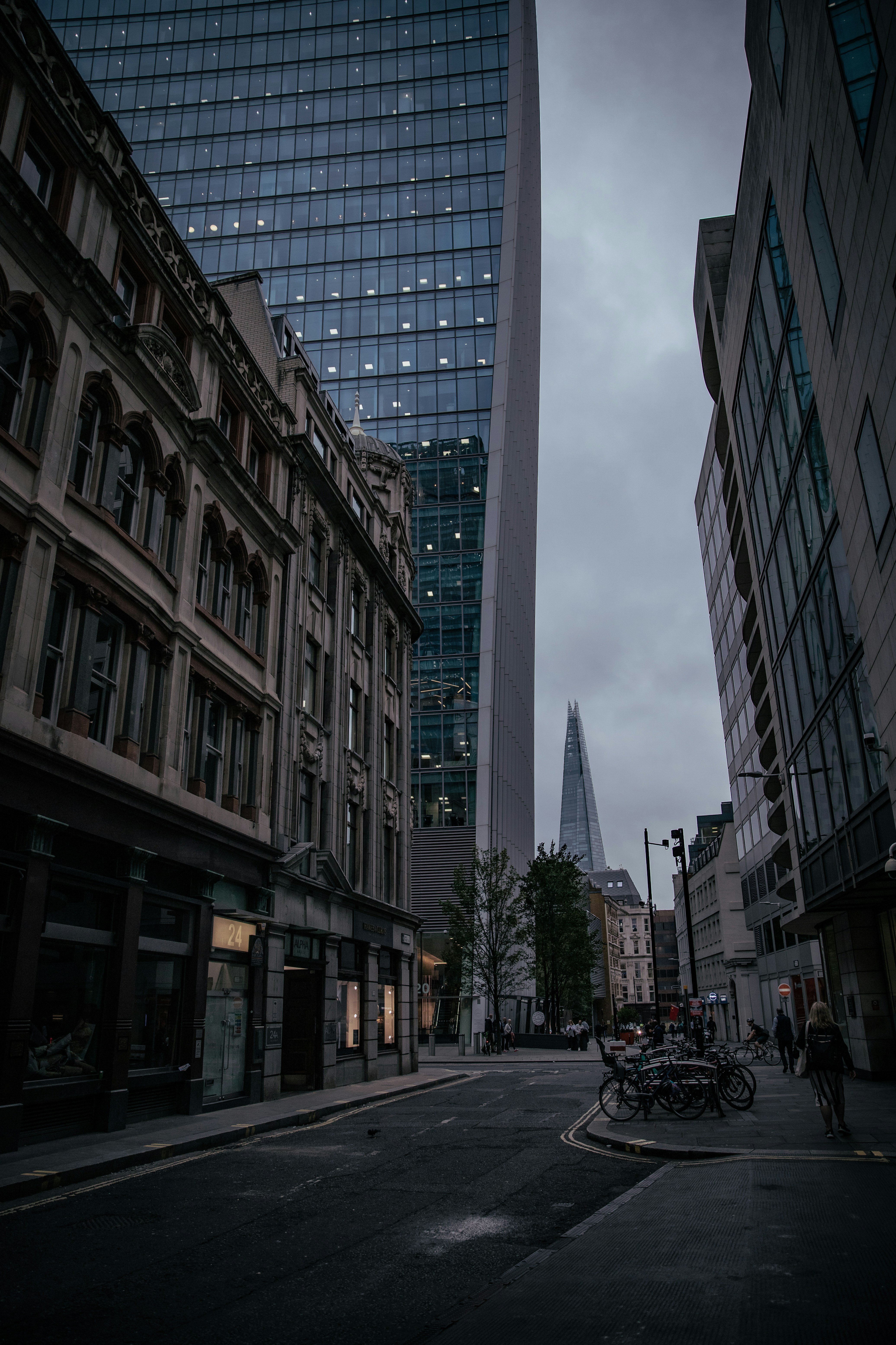 a city street with tall buildings in the background