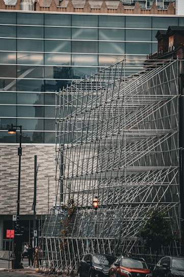 Close-up of modular scaffolding components neatly stacked, ready for event setup in a Middle Eastern city.