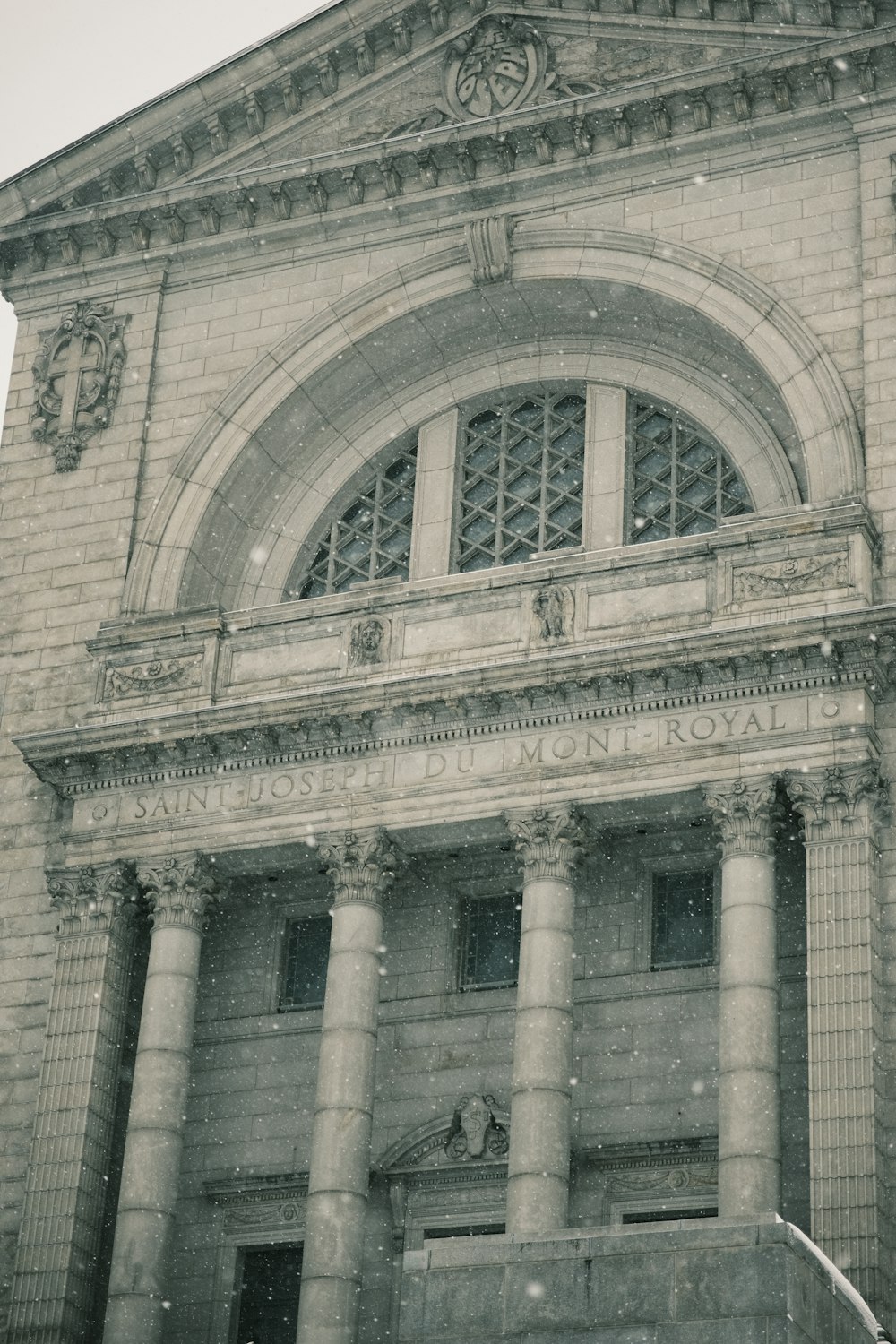 an old building with a clock on the front of it