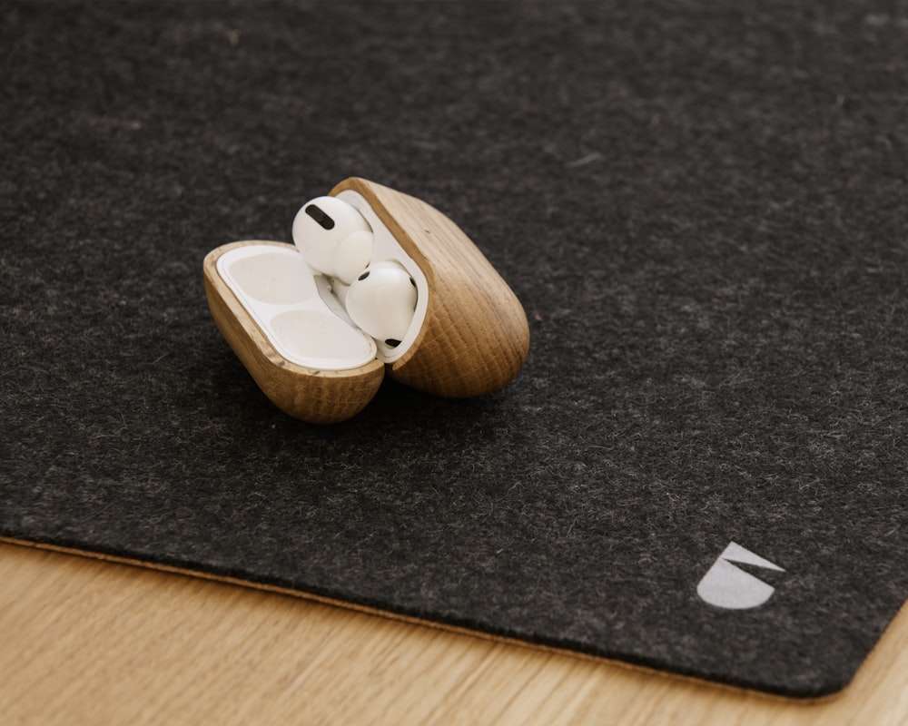 a pair of ear buds sitting on top of a rug