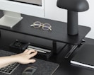 Sleek gadgets and accessories neatly arranged on a modern desk