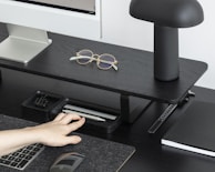 Close-up of ergonomic accessories arranged on a clean desk.