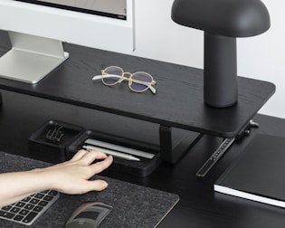 An executive desk setup highlighting ergonomic design and cable management.