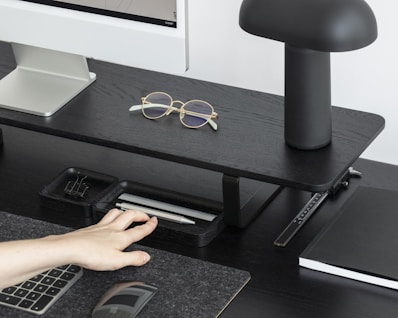 A sleek desk setup with a laptop and stationery.