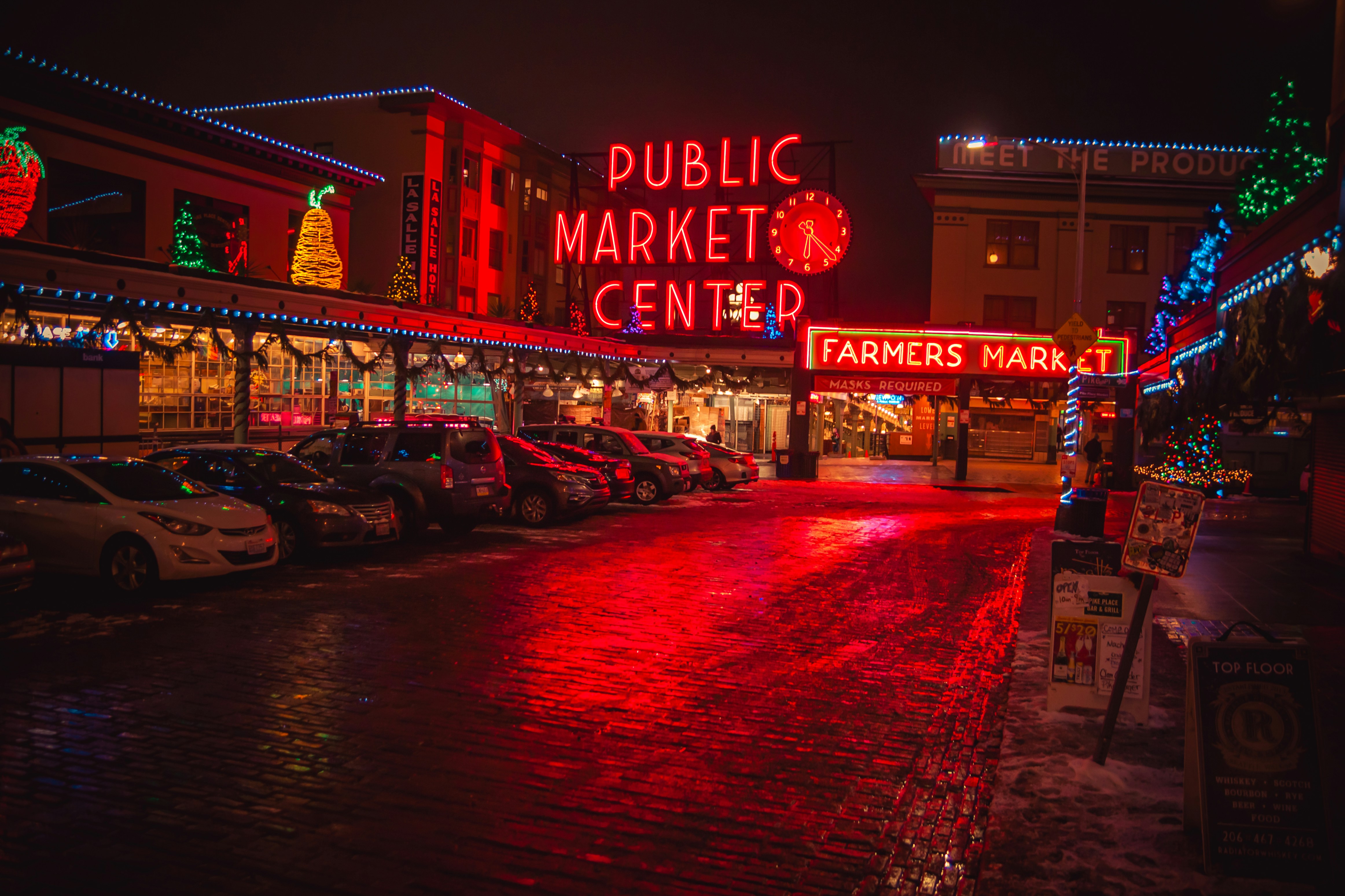 a public market center with cars parked in front of it