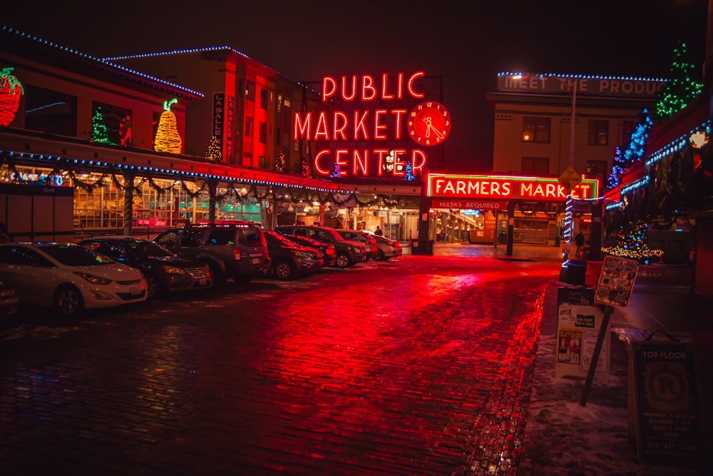 a public market center with cars parked in front of it