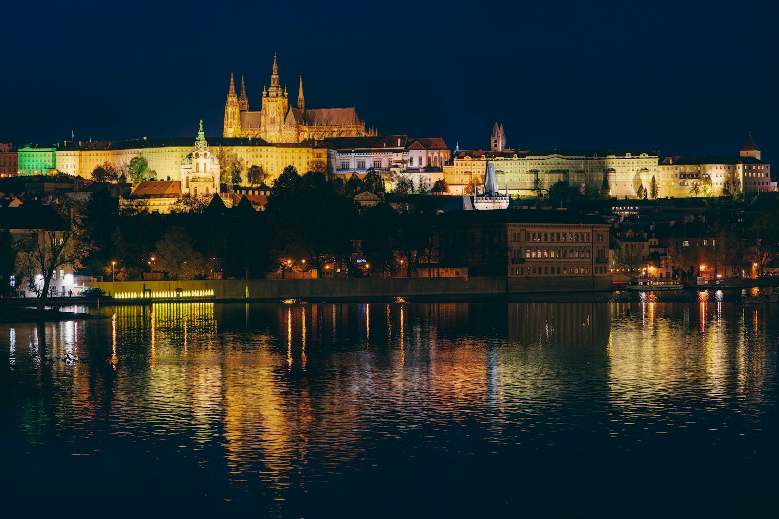 European castle lit up at night
