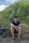 a man sitting on a chair in front of a mountain
