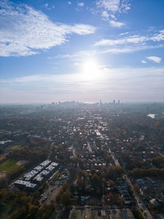 Aerial view of residential plots with clear boundaries under sunlight.