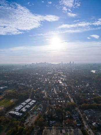 Aerial view of residential plots with clear boundaries under sunlight.