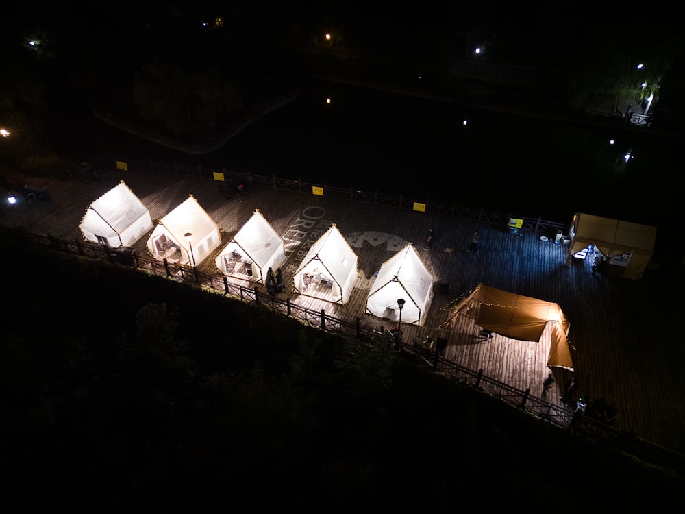 a group of tents lit up at night
