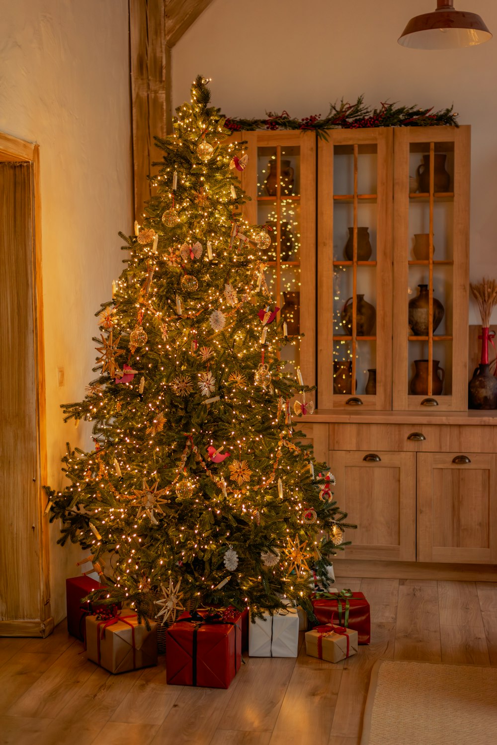 a lit christmas tree in a living room